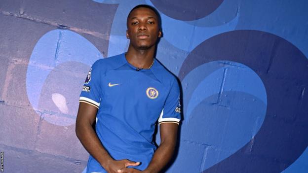 Moises Caicedo posing in a Chelsea shirt