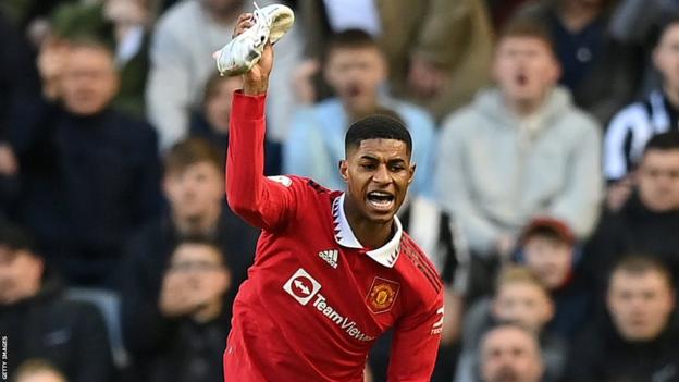 Marcus Rashford throws his boot to the ground in frustration during the defeat at Newcastle
