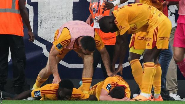 Rodez midfielder Lucas Buades (centre) is connected  the crushed  aft  being shoved to the crushed  against Bordeaux