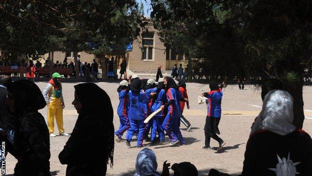 Afghan girls play cricket at a school in Herat in 2013