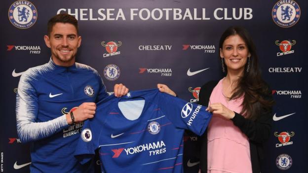 Marina Granovskaia poses with new Chelsea signing Jorginho and a club shirt