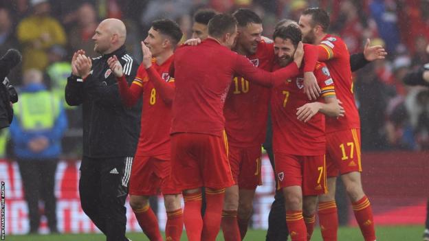 Joe Allen is congratulated after Wales' play-off win over Ukraine