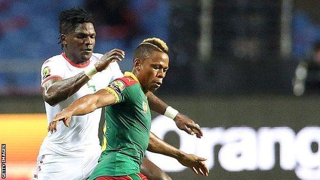 Cameroon's Clinton N'Jie (right)