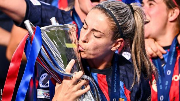 Alexia Putellas celebrates with her Barcelona team-mates after winning the Champions League in June