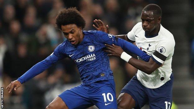 Dele Alli of Tottenham and Willian of Chelsea seen during the