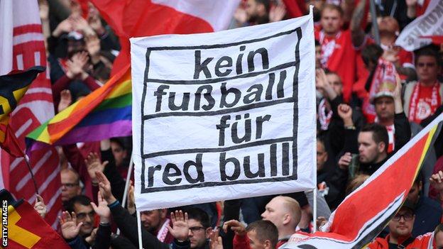 Bayern Munich fans hold a banner reading: 'Kein fussball fur Red Bull' (no football for Red Bull)