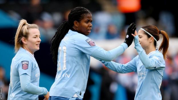 Lauren Hemp, Khadija Shaw and Yui Hasegawa celebrate after Shaw scores for Manchester City against Eveton