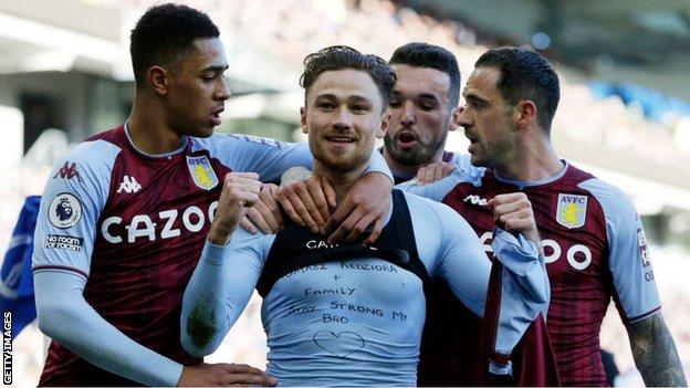 Matty Cash celebrates scoring against Brighton