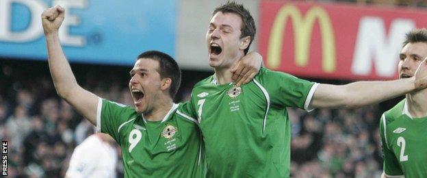 David Healy and Jonny Evans