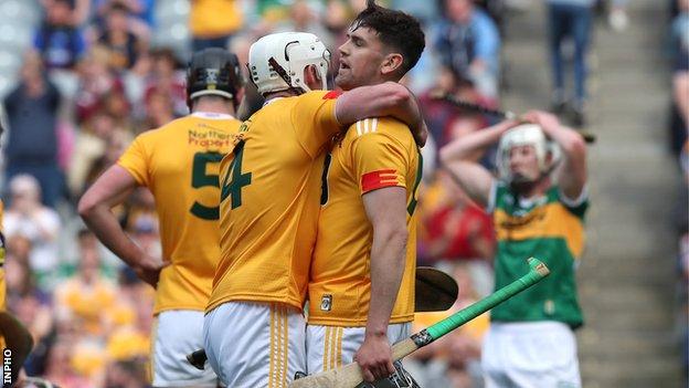 Antrim vice-captain Paddy Burke embraces fellow defender David Kearney after the Saffrons held on to beat Kerry 5-22 to 4-24 in last weekend's Joe McDonagh Cup Final