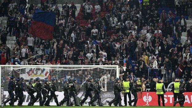Riot police look to halt any crowd trouble at full-time in Lyon