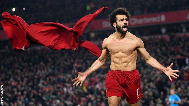Liverpool forward Mohamed Salah celebrates scoring the second goal against Manchester United at Anfield on Sunday