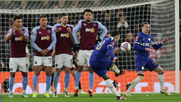 Enzo Fernandez scores the team's third goal from a free-kick during the English FA Cup fourth round replay