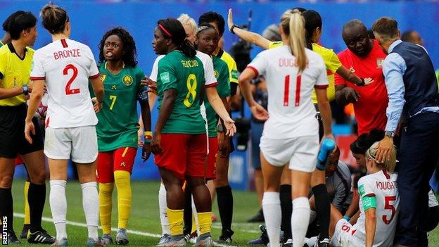Cameroon captain Gabrielle Onguene (third left) was angry after Steph Houghton was injured by Alexandra Takounda Engolo's late challenge in injury time