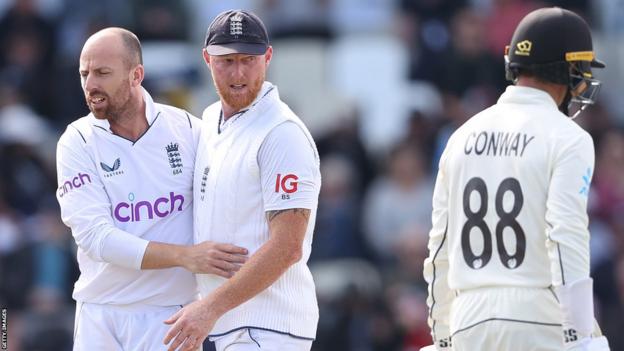 Jack Leach and Ben Stokes celebrate the wicket of Devon Conway