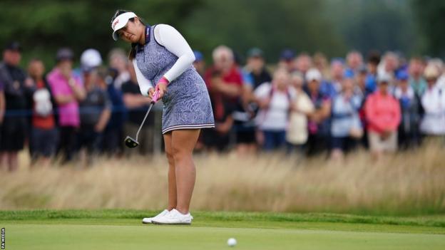 Lilia Vu putts towards the hole