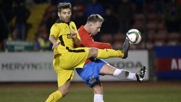 Cliftonville's David McDaid and Thomas Lambe of Ards vie for possession