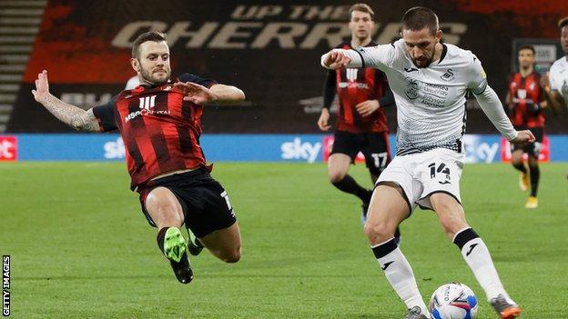 Bournemouth's Jack Wilshere stretches to block Swansea's Conor Hourihane