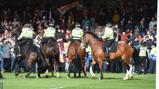 Motherwell fans ran onto the pitch following the 3-0 win