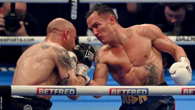 Josh Warrington lands an uppercut on the chin of Kiko Martinez