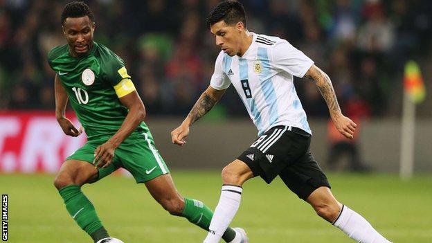 Nigeria captain John Mikel Obi (left) in action against Argentina