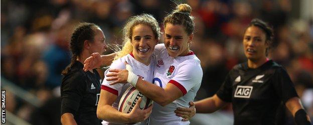 England's Abby Dow and Claudia MacDonald celebrate a try