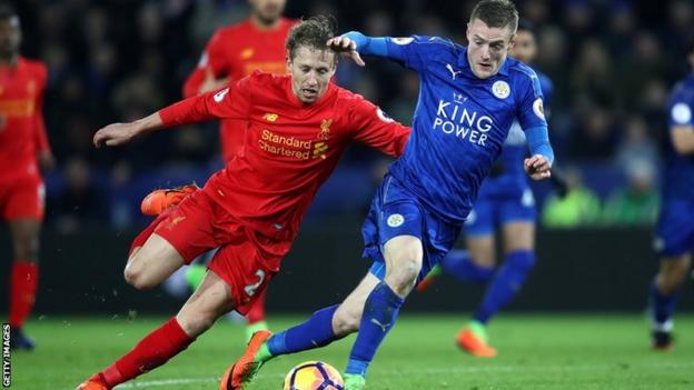 Lucas battles with Leicester's Jamie Vardy