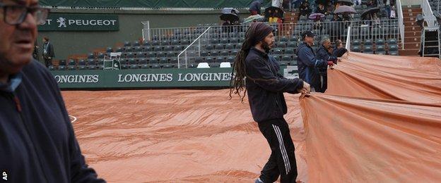 Court coverers at the French Open