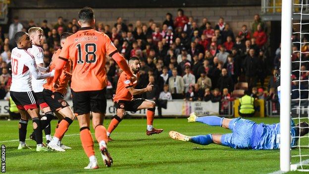 Dundee United's Aziz Behich makes it 1-0 during a cinch Premiership match between Dundee United and Aberdeen at Tannadice, on October 08, 2022,