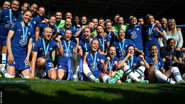Chelsea celebrate with the WSL trophy