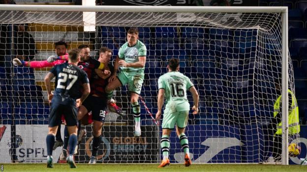 Yan Dhanda's corner evaded an under-pressure David Marshall to earn Ross County a point