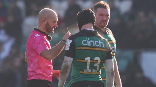 Fraser Dingwall of Northampton Saints is shown a red card after a collision with Dillyn Leyds