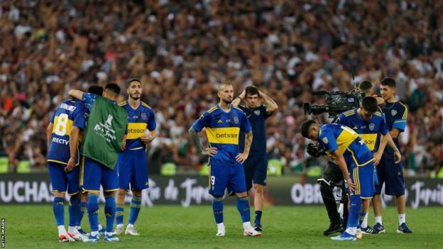 Boca Juniors players look distraught at full-time