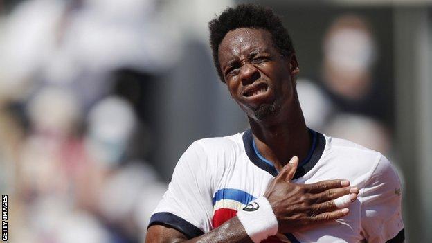 Gael Monfils celebrates with the French crowd on Court Suzanne Lenglen