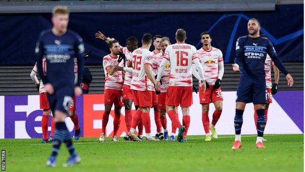 RB Leipzig players celebrate a goal against Manchester City in the Champions League