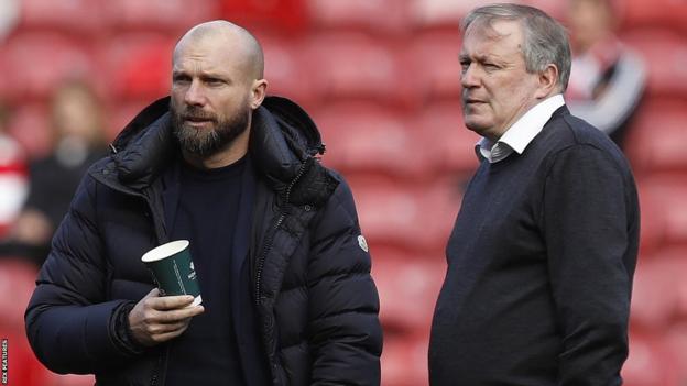 Neil Dewsnip (right) stands with former Argyle head coach Ian Foster
