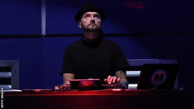 A DJ plays music at the ATP Next Gen Finals in Milan