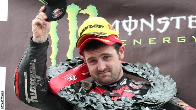 Michael Dunlop celebrates his Supersport victory in the Isle of Man
