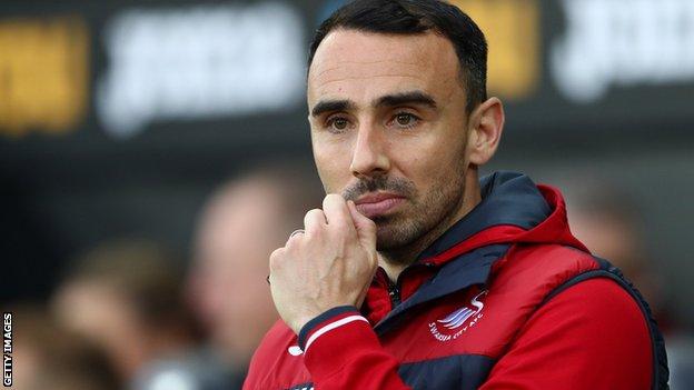 A pensive looking Leon Britton watches Swansea City taking on Crystal Palace