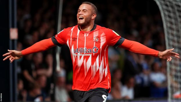 Carlton Morris celebrates a goal for Luton Town