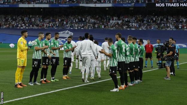 Real Betis' players give La Liga champions Real Madrid a guard of honour