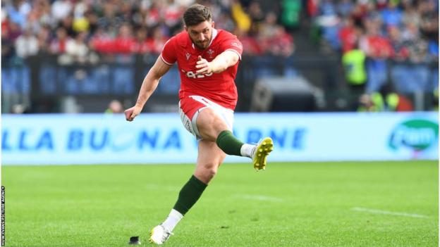 Owen Williams kicks at goal for Wales against Italy in the 2023 Six Nations match in Rome