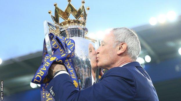 Claudio Ranieri kisses the Premier League trophy