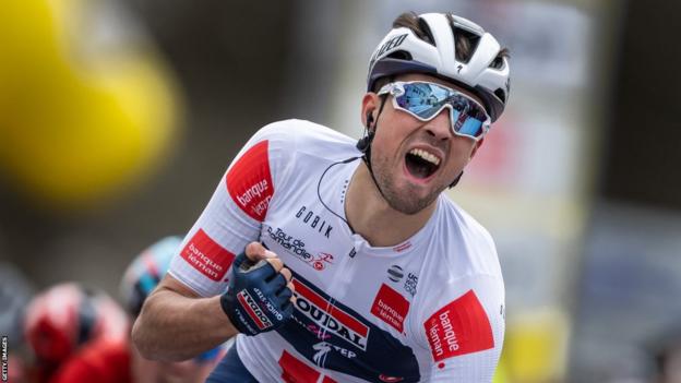British cyclist Ethan Vernon punches the air in celebration after winning stage one of the Tour de Romandie