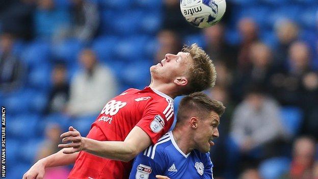 Nottingham Forest's Joe Worrall and Cardiff's Anthony Pilkington tangle at the Cardiff City Stadium