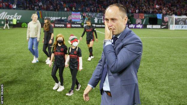 Portland Thorns FC head coach Mark Parsons wipes away a tear after a game between Chicago Red Stars and Portland Thorns