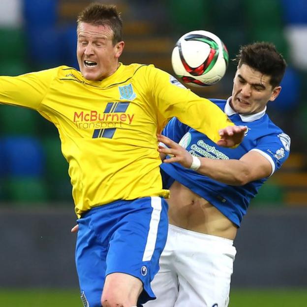 Ballymena United's Allan Jenkins in action against Jimmy Callacher during the fifth round match which Linfield won 2-1