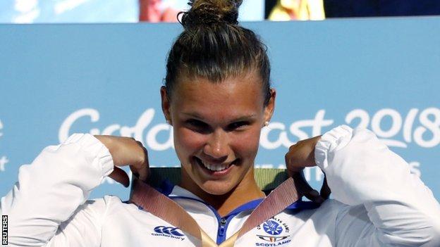 Grace Reid celebrates with her Commonwealth Games gold medal