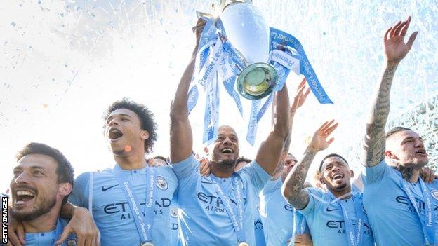 Vincent Kompany lifts the Premier League trophy