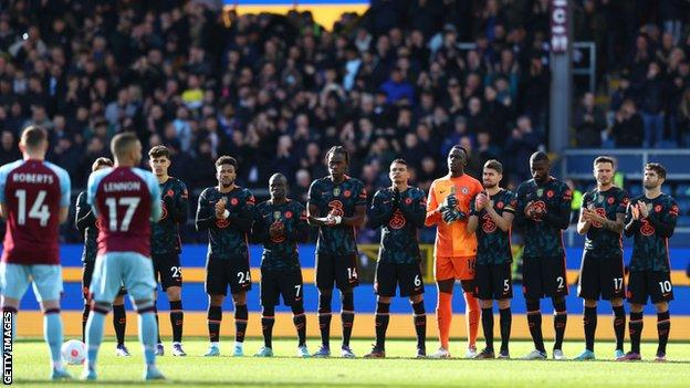 Chelsea and Burnley players applaud for Ukraine before their Premier League match at Turf Moor